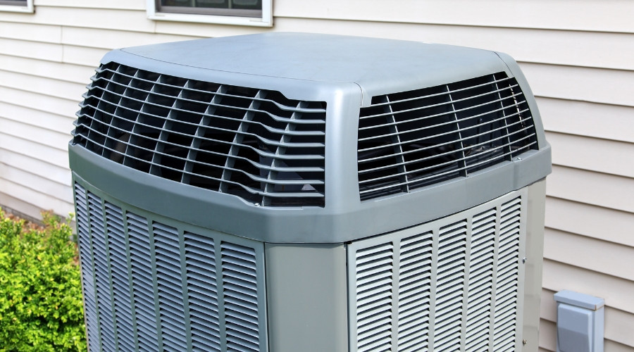 Central air conditioning unit installed outside a home, showcasing its cooling capabilities relevant to HVAC services and home comfort solutions.