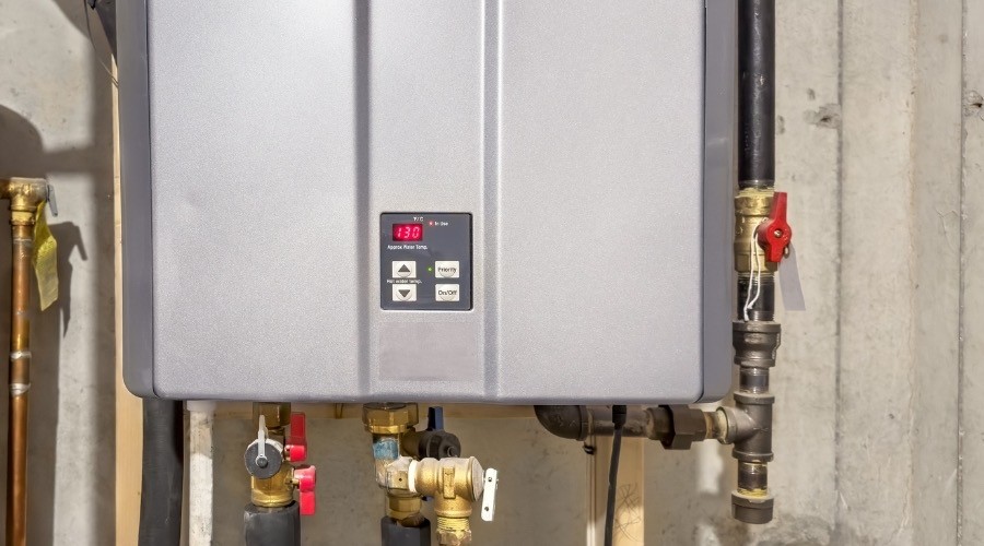 Tankless water heater installation and modern heating system technology.